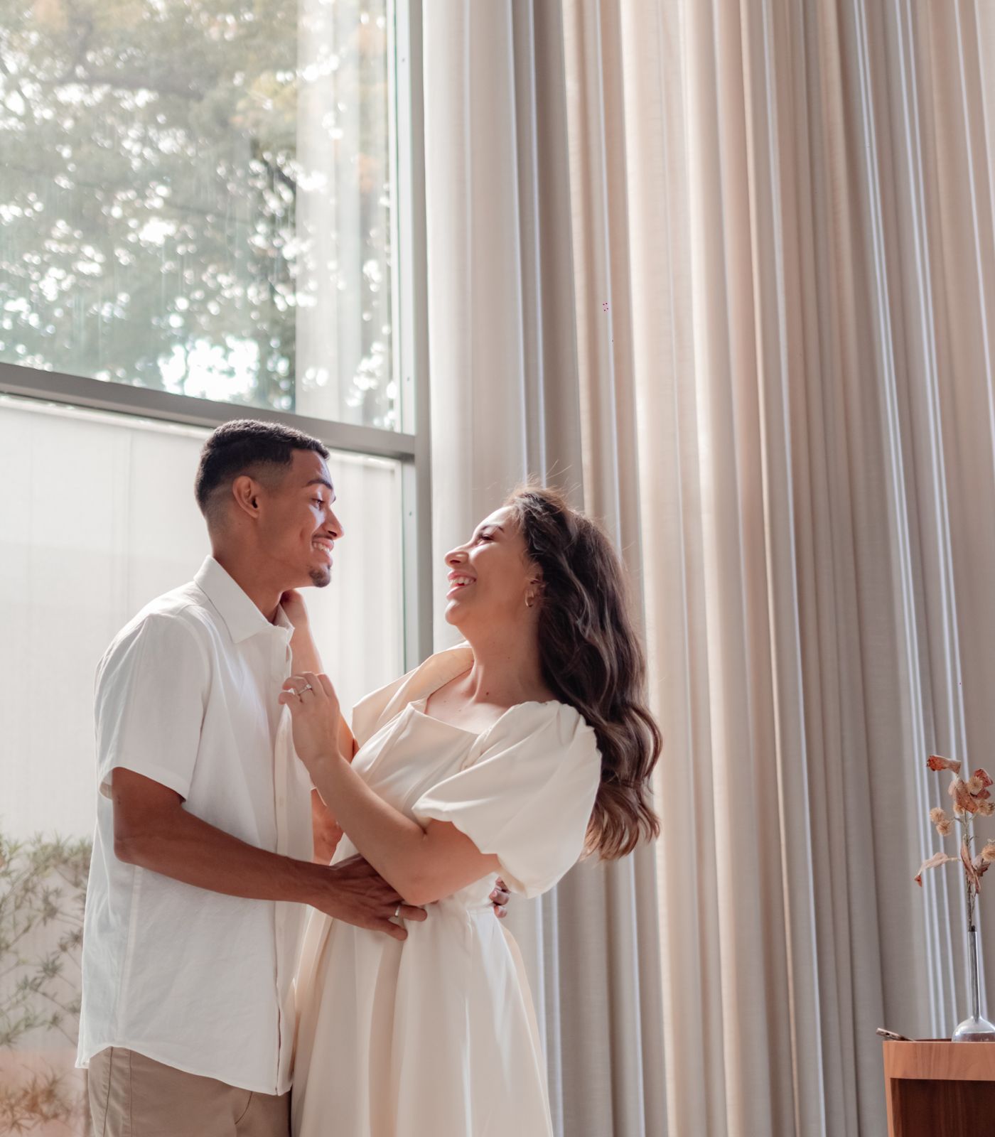 A couple sharing a quiet, close moment at home